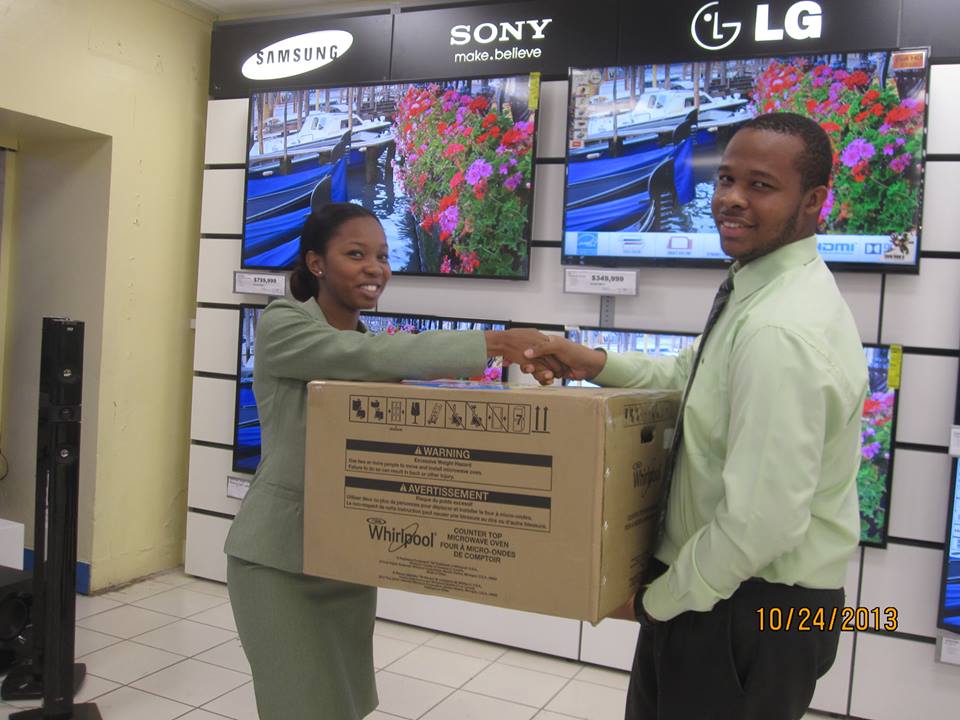 Courts Guyana Donates Microwave to GCCI!